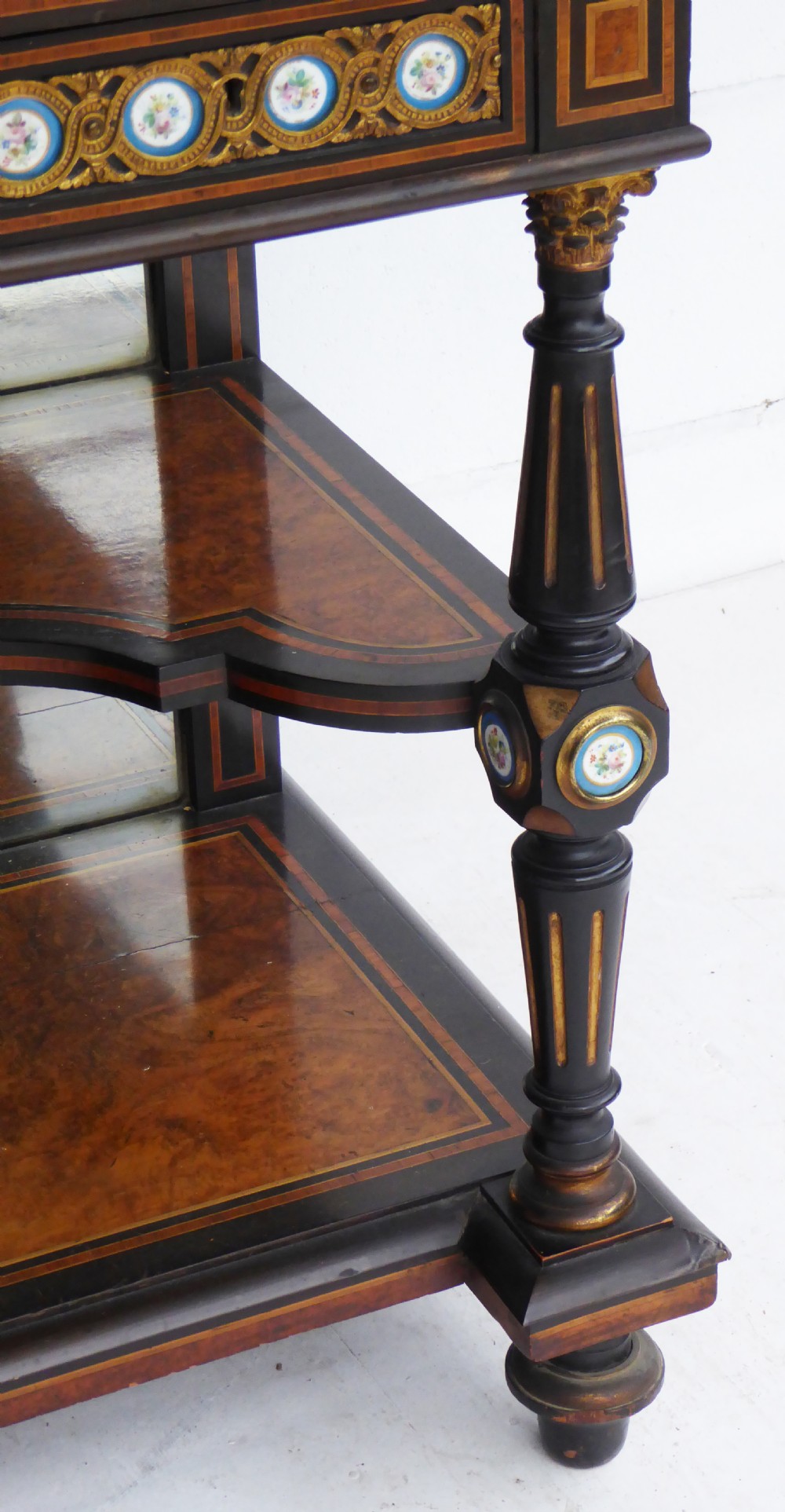 An ebonised and walnut 19th-century Bonheur du Jour writing desk featuring porcelain plaque inserts, gilded mounts, mirrors, and lower tier shelves. View XII