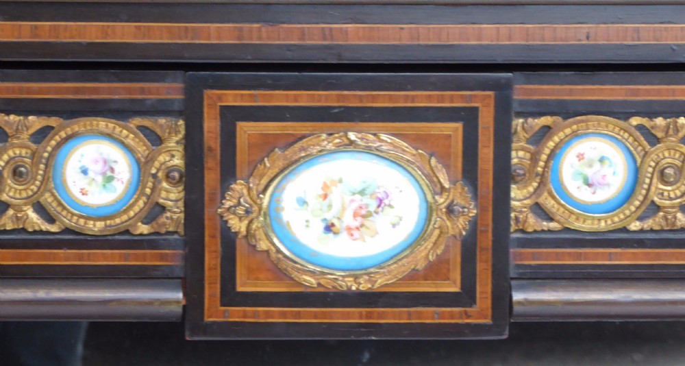 An ebonised and walnut 19th-century Bonheur du Jour writing desk featuring porcelain plaque inserts, gilded mounts, mirrors, and lower tier shelves. View XIII