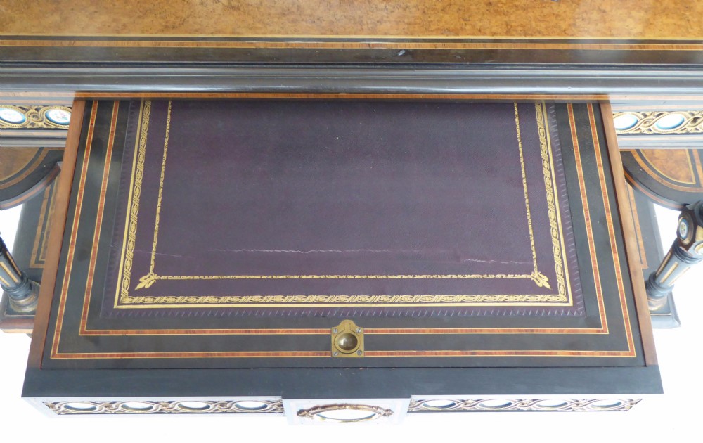 An ebonised and walnut 19th-century Bonheur du Jour writing desk featuring porcelain plaque inserts, gilded mounts, mirrors, and lower tier shelves. View XIV