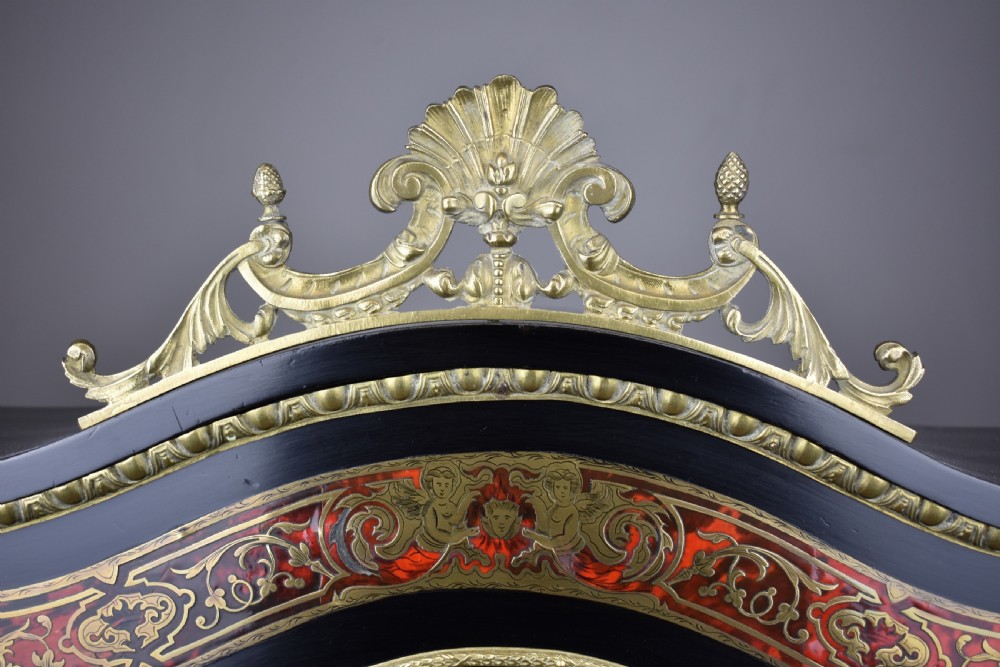 A 19th-century ebonised French bonheur du jour writing desk featuring red tortoiseshell and brass Boulle marquetry, cabriole legs, and gilt-bronze mounts. View VIII