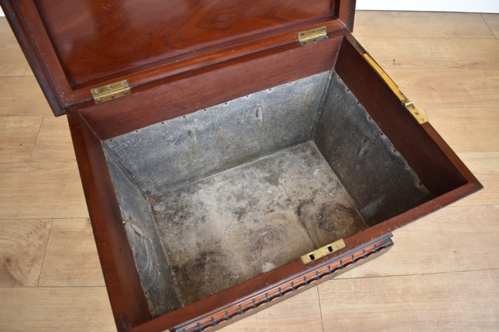 A 19th-century William IV sarcophagus-shaped mahogany wine cooler with a stepped lid and gadrooned plinth base. View III