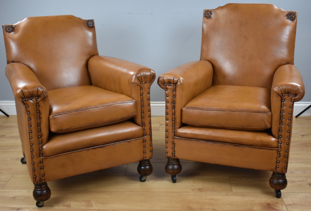 Pair Victorian Tan Leather Ladies and Gents armchairs