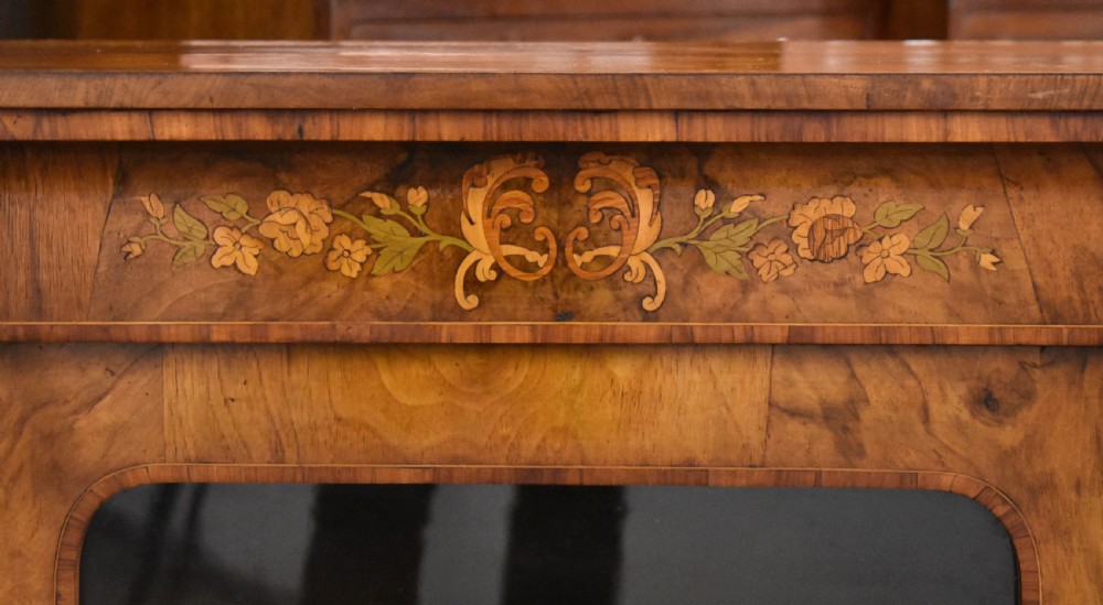 A Victorian walnut pier cabinet with a single glazed door, floral marquetry inlay, and gilt ormolu mounts. View IV