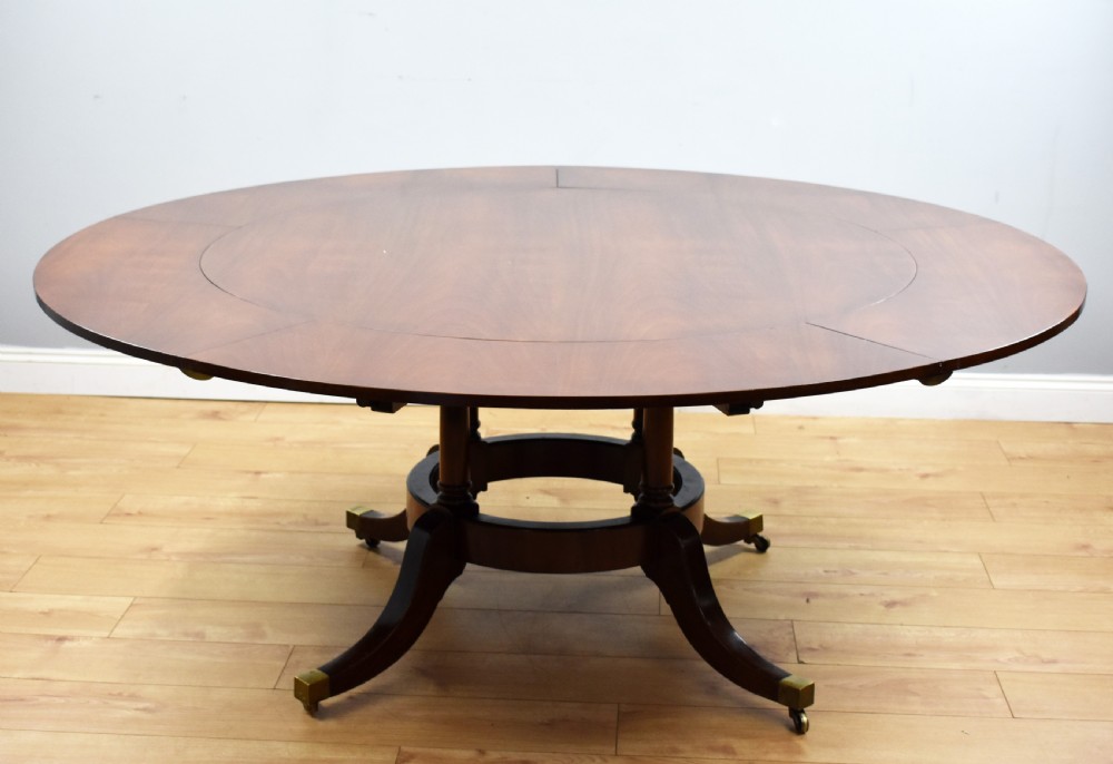 Large Mahogany Circular Extending Dining Table View XIV