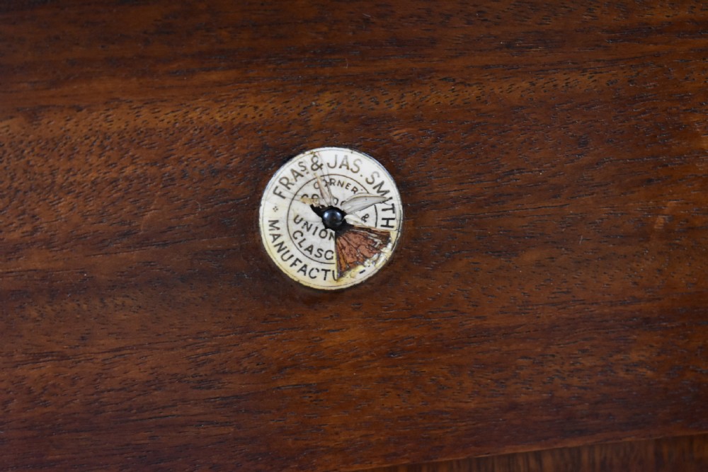 A Victorian mahogany kneehole desk with three leather-inlaid writing panels, twin pedestals featuring arched mouldings, and brass handles. View XIII