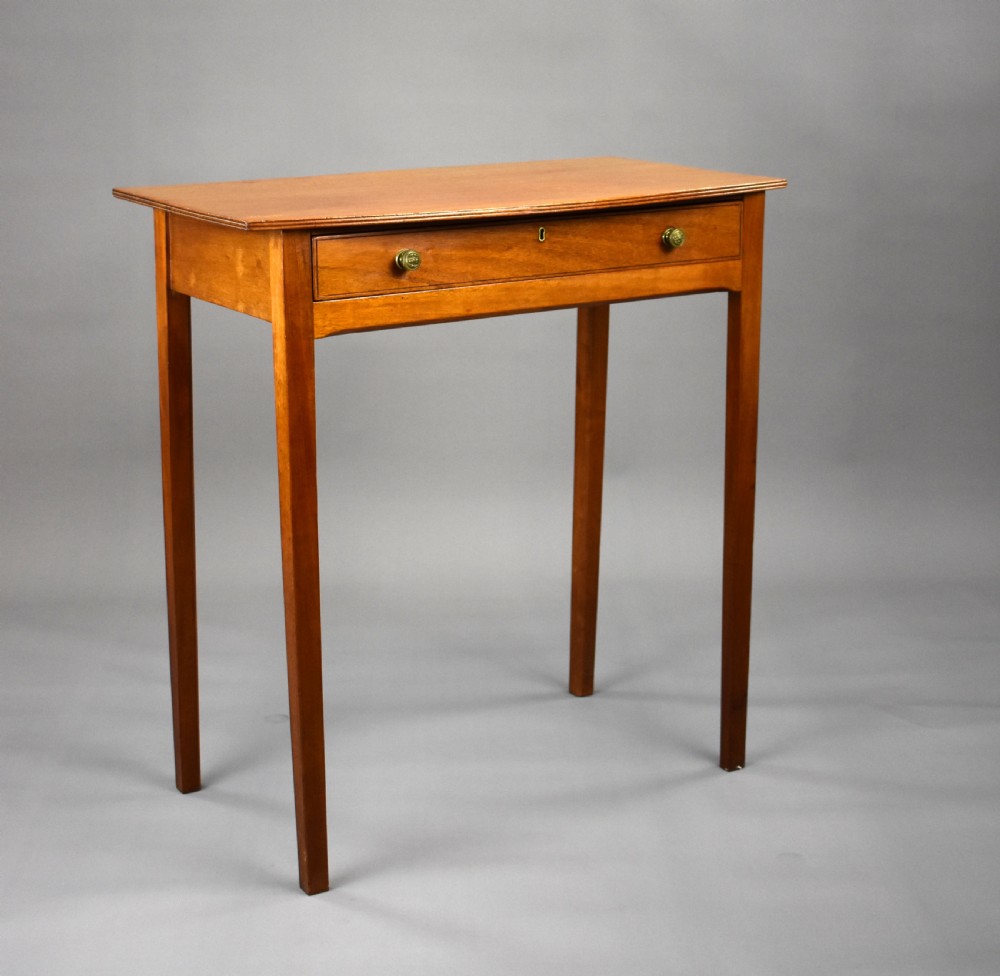 A 19th-century mahogany side table featuring a single drawer with brass knobs and tall, square tapered legs.