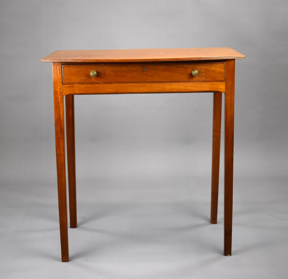 A 19th-century mahogany side table featuring a single drawer with brass knobs and tall, square tapered legs. View II