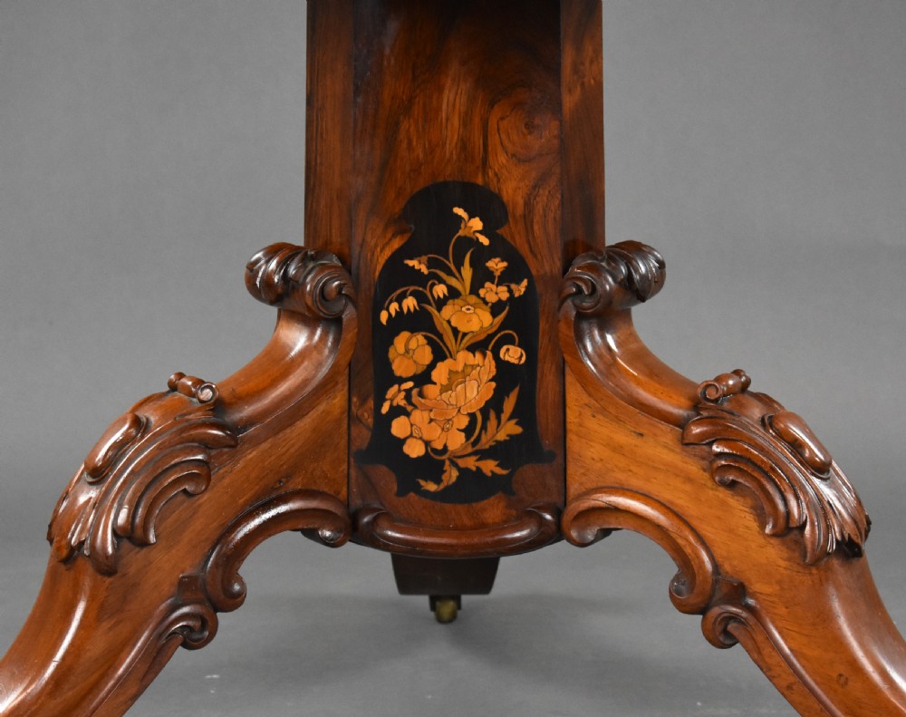 A Victorian burr walnut tilt-top breakfast table featuring a scalloped edge, intricate floral marquetry inlay border, and a carved four-star pedestal base. View XI