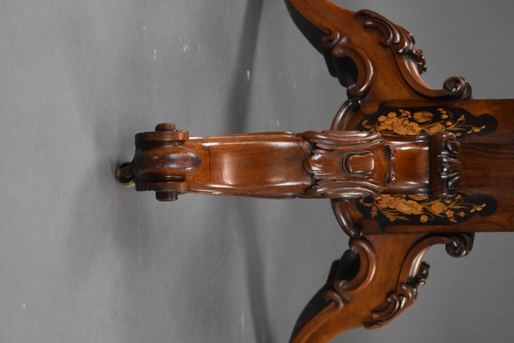 A Victorian burr walnut tilt-top breakfast table featuring a scalloped edge, intricate floral marquetry inlay border, and a carved four-star pedestal base. View XV