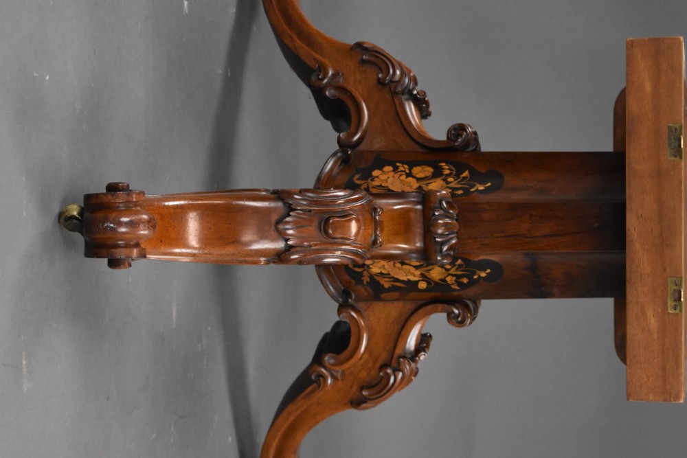 A Victorian burr walnut tilt-top breakfast table featuring a scalloped edge, intricate floral marquetry inlay border, and a carved four-star pedestal base. View XVIII