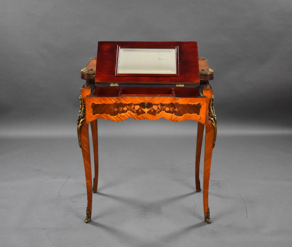 A Victorian French-style marquetry card table featuring slender cabriole legs with brass mounts and intricate floral inlay along the serpentine apron. View VII