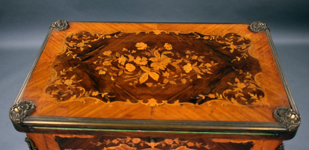 A Victorian French-style marquetry card table featuring slender cabriole legs with brass mounts and intricate floral inlay along the serpentine apron. View XVI