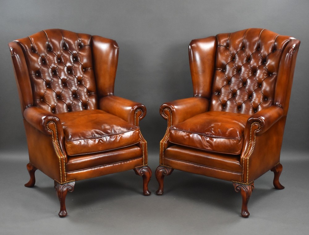 Pair of Leather Wing Back Armchairs