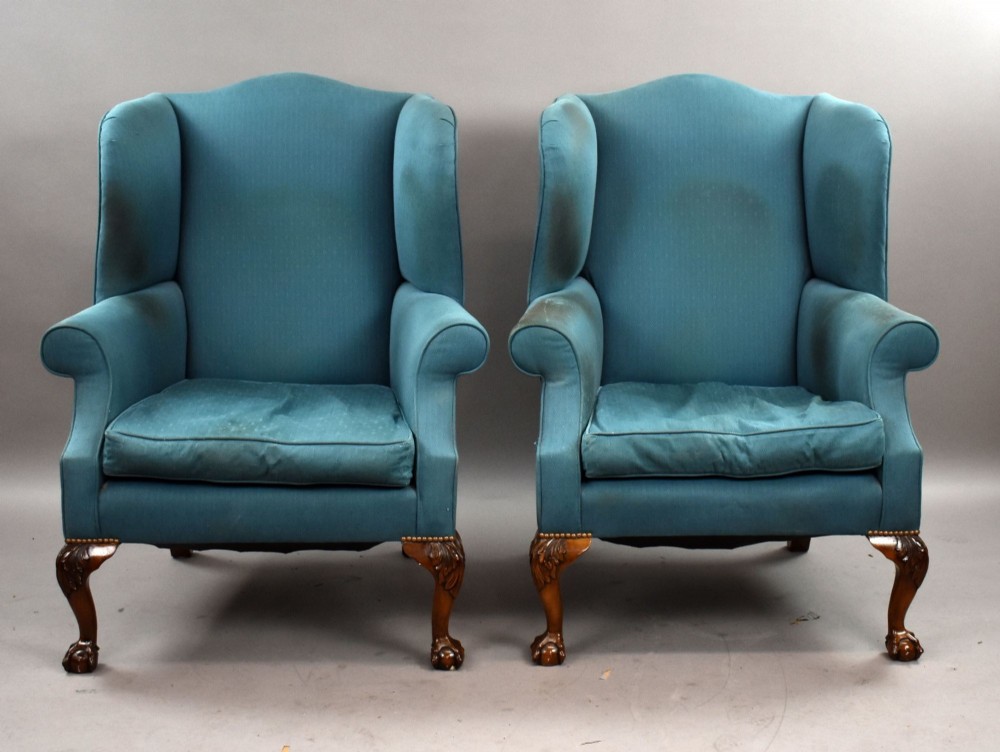 A pair of antique wingback armchairs upholstered in teal blue fabric with carved mahogany cabriole legs and claw-and-ball feet. View II