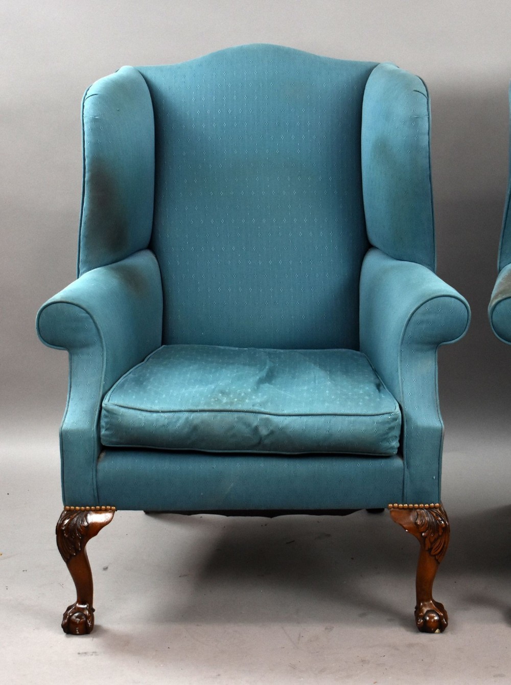 A pair of antique wingback armchairs upholstered in teal blue fabric with carved mahogany cabriole legs and claw-and-ball feet. View III