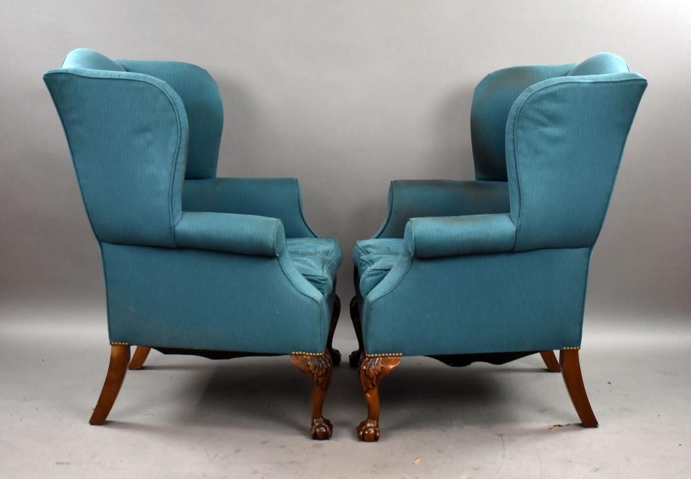 A pair of antique wingback armchairs upholstered in teal blue fabric with carved mahogany cabriole legs and claw-and-ball feet. View VIII