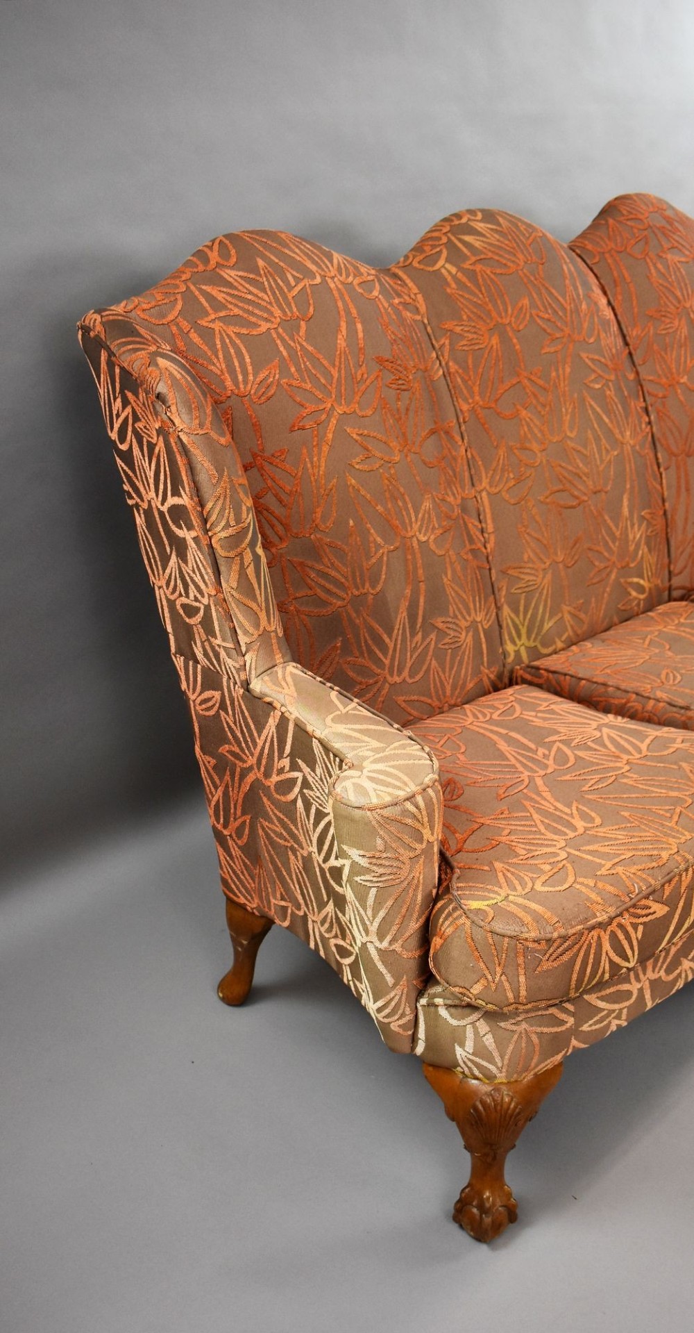 A Queen Anne style three-seat sofa featuring terracotta leaf-patterned upholstery, a triple-arched backrest, and carved walnut cabriole legs with ball-and-claw feet. View III