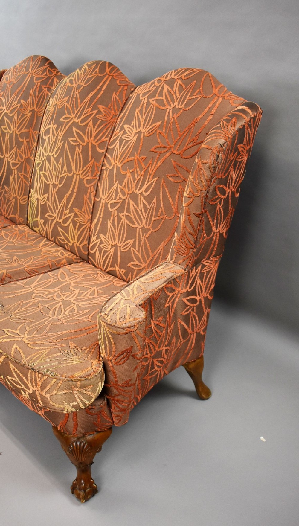 A Queen Anne style three-seat sofa featuring terracotta leaf-patterned upholstery, a triple-arched backrest, and carved walnut cabriole legs with ball-and-claw feet. View IV