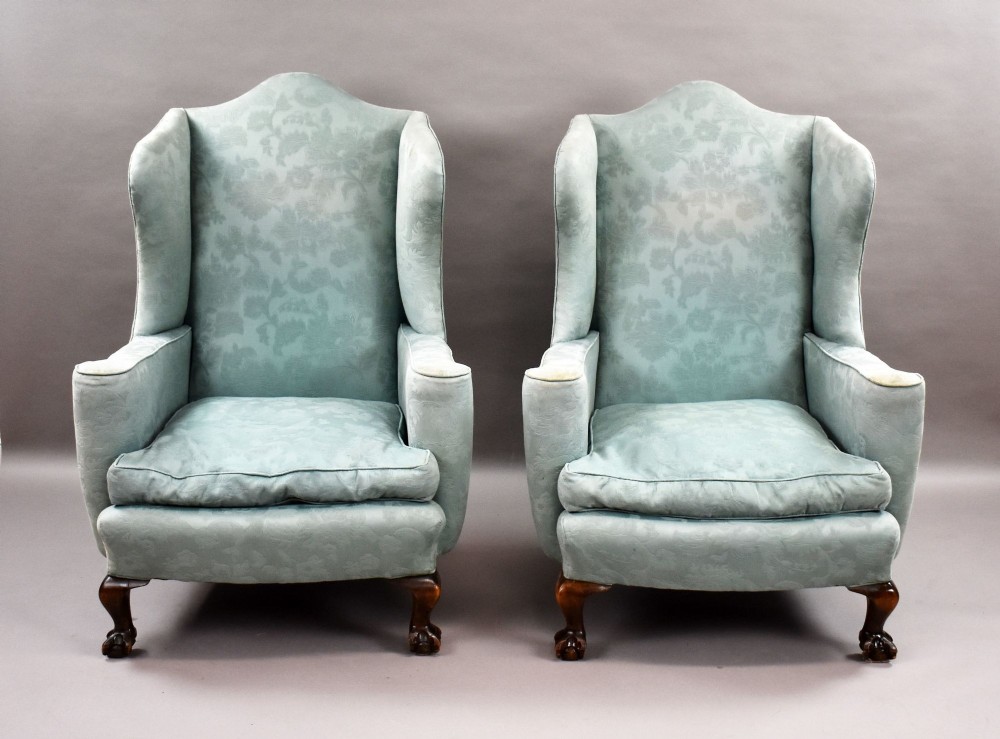 A pair of antique wingback armchairs upholstered in duck egg blue damask fabric with carved cabriole legs and ball-and-claw feet. View II