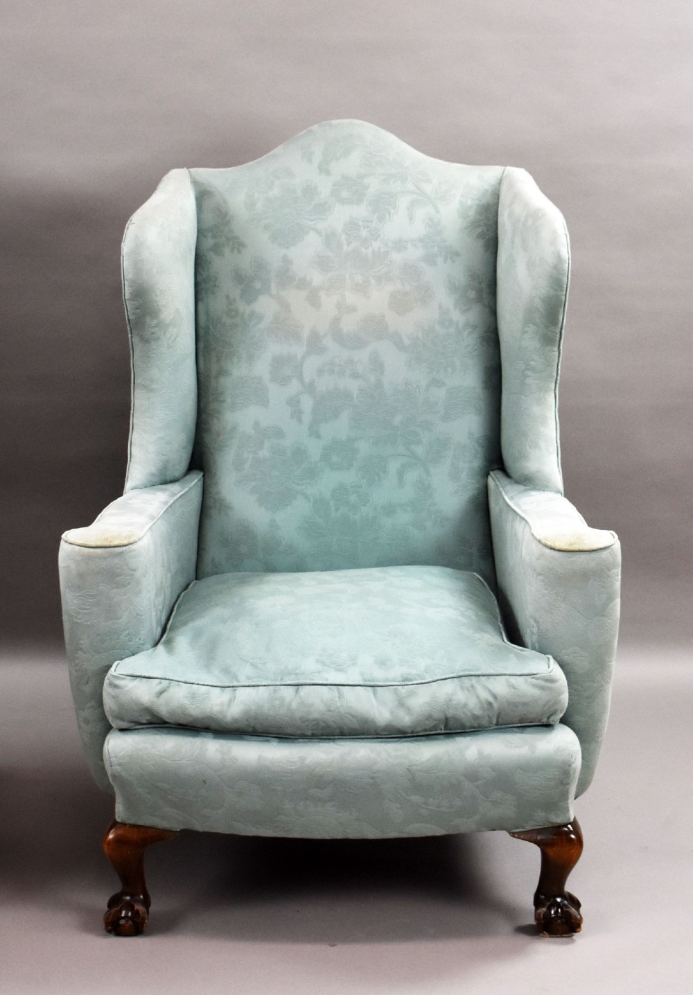 A pair of antique wingback armchairs upholstered in duck egg blue damask fabric with carved cabriole legs and ball-and-claw feet. View IV