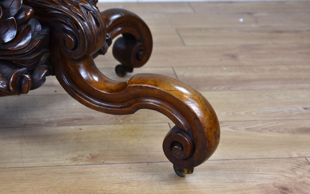 A Victorian tilt-top loo table shown vertically, featuring quarter-matched burr walnut veneer with a scalloped edge on carved cabriole legs. View VIII