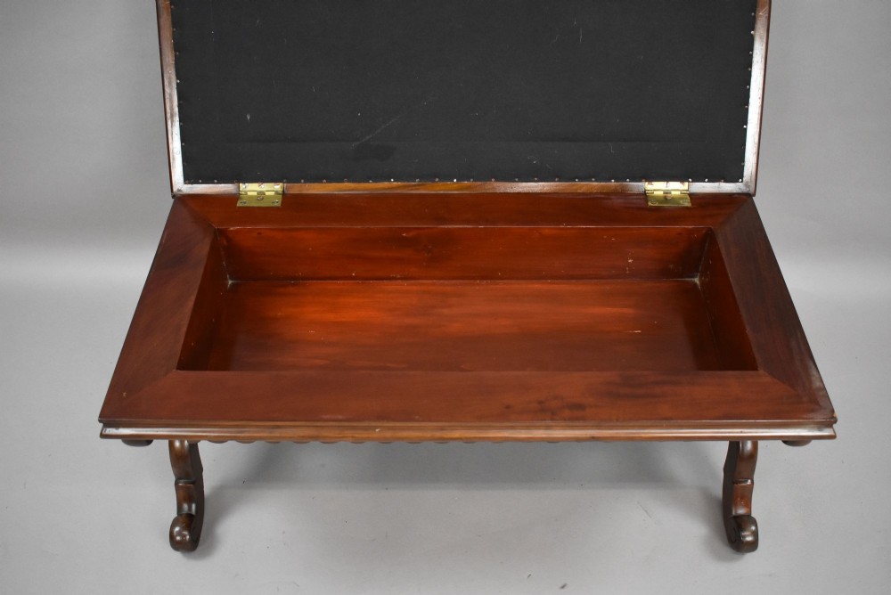 A William IV mahogany stool featuring a scalloped apron, carved scroll end supports, a turned central stretcher, and an off-white upholstered seat cushion. View VII