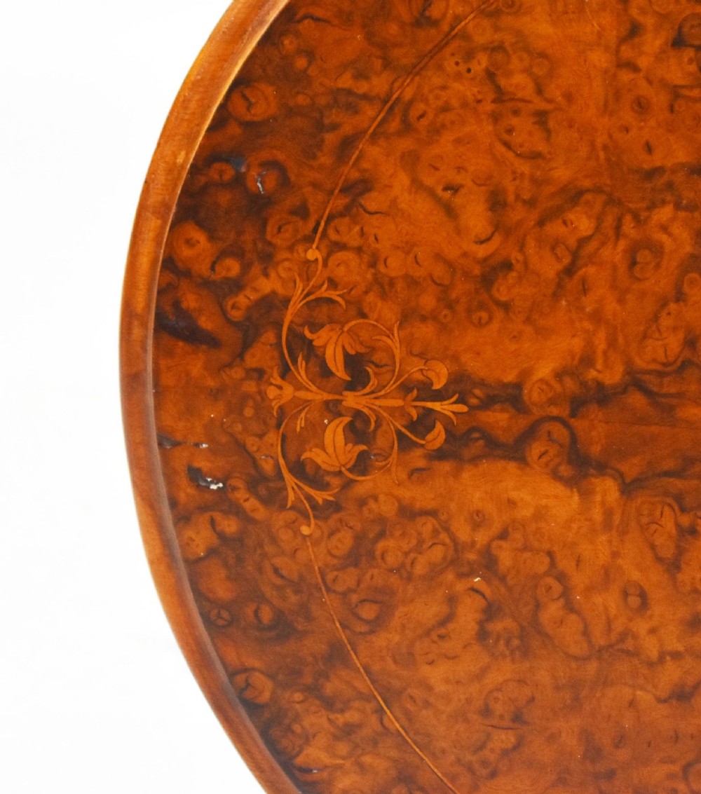 A Victorian burr walnut occasional table featuring a figure-patterned top, a barley twist carved stem, and a carved tripod base. View VIII