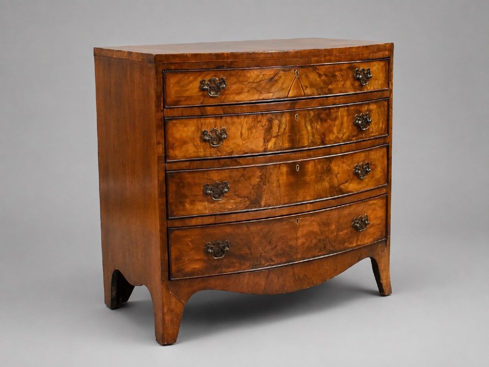Early 20th Century Figured Walnut Bow Front Chest of Drawers