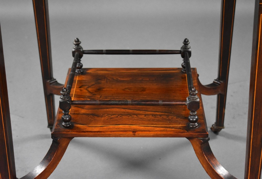 An Edwardian inlaid rosewood envelope card table with tapered square legs, brass castors, a lower undertier shelf, and a top split into four triangular leaves. View XIII