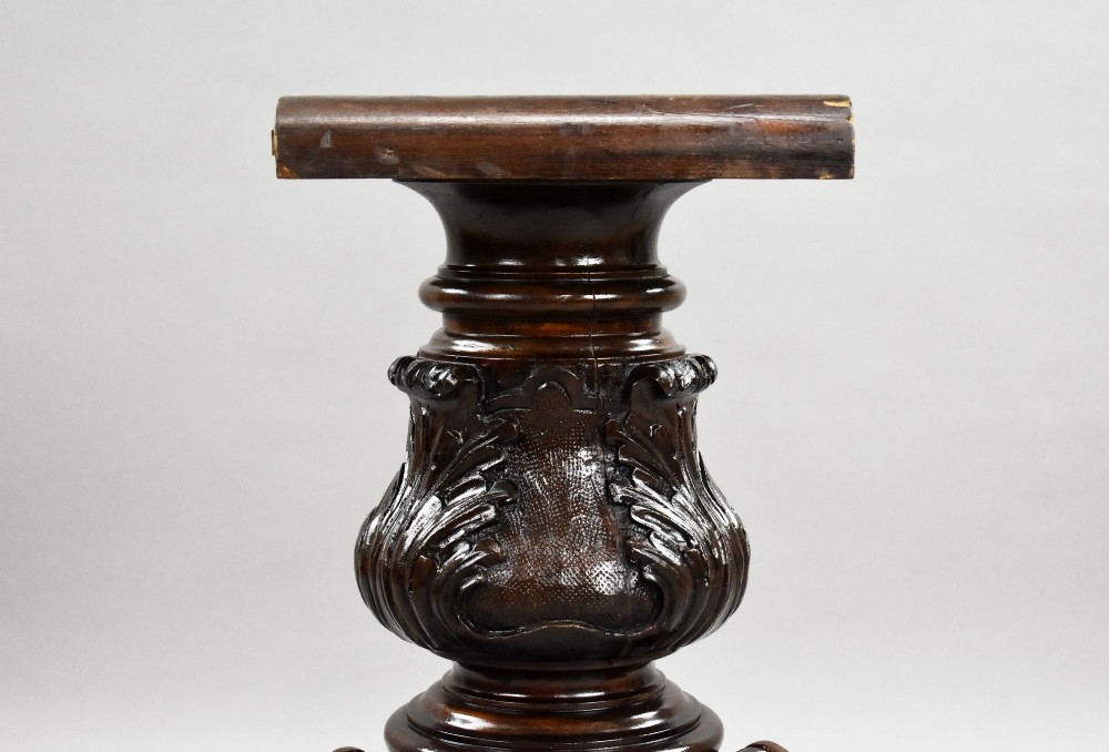 A Victorian circular burr walnut centre table featuring floral marquetry inlays on the tabletop and a dark carved pedestal base. View VI