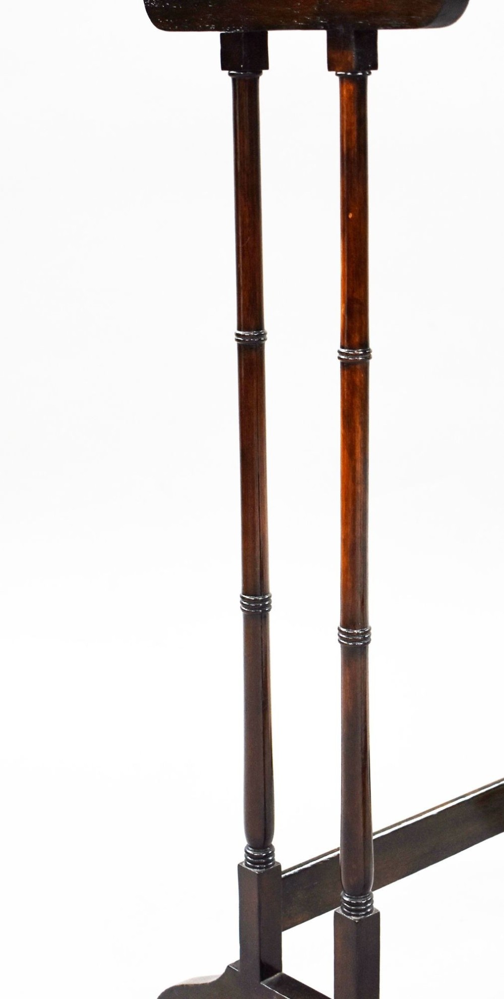 An Edwardian nest of three graduating mahogany tables with turned legs and trestle feet. View VIII