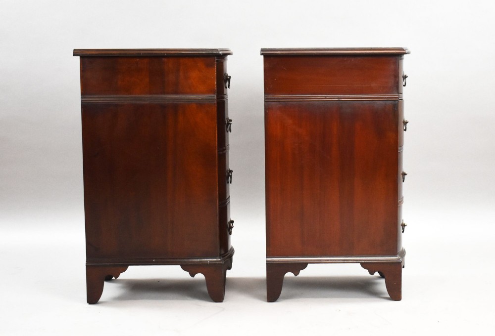 A pair of narrow mahogany bow-front bedside chests featuring four drawers each with brass drop handles and bracket feet. View III