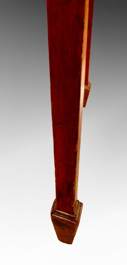 A Georgian mahogany side table featuring a gently curved bow front and four slender square-tapered legs terminating in spade feet. View II
