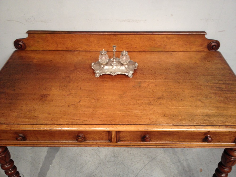 Antique oak writing table by T Seddon. View II