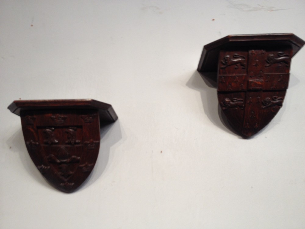 Pair of antique carved oak brackets.