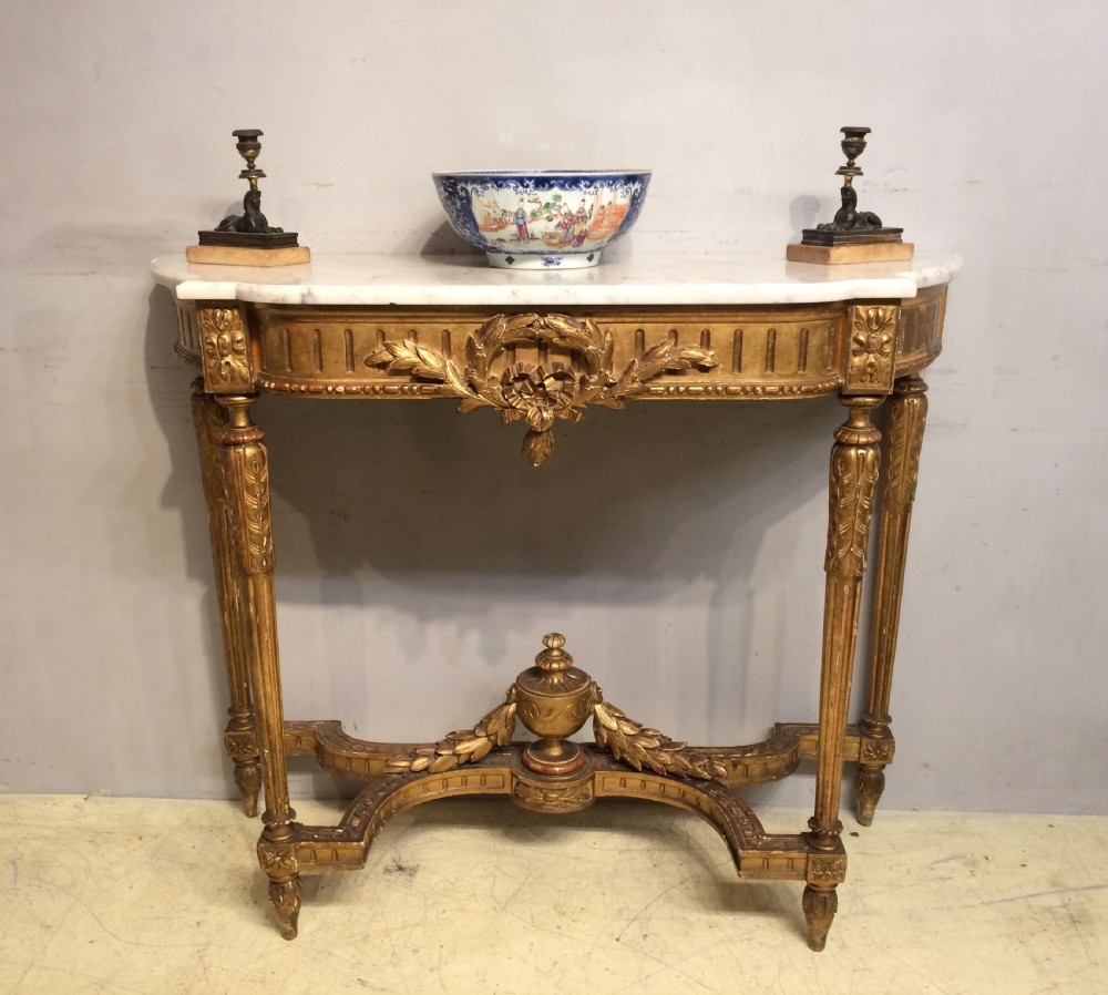French carved giltwood console table with marble top. View II