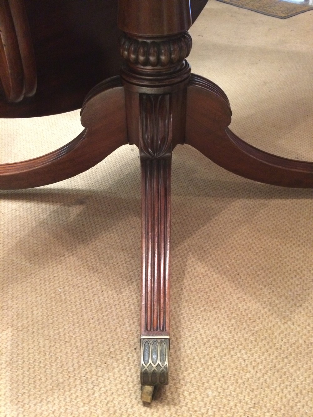 Regency circular mahogany extending dining table. View VIII