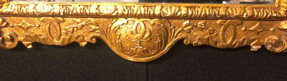 Geo II style carved giltwood wall mirror. View III