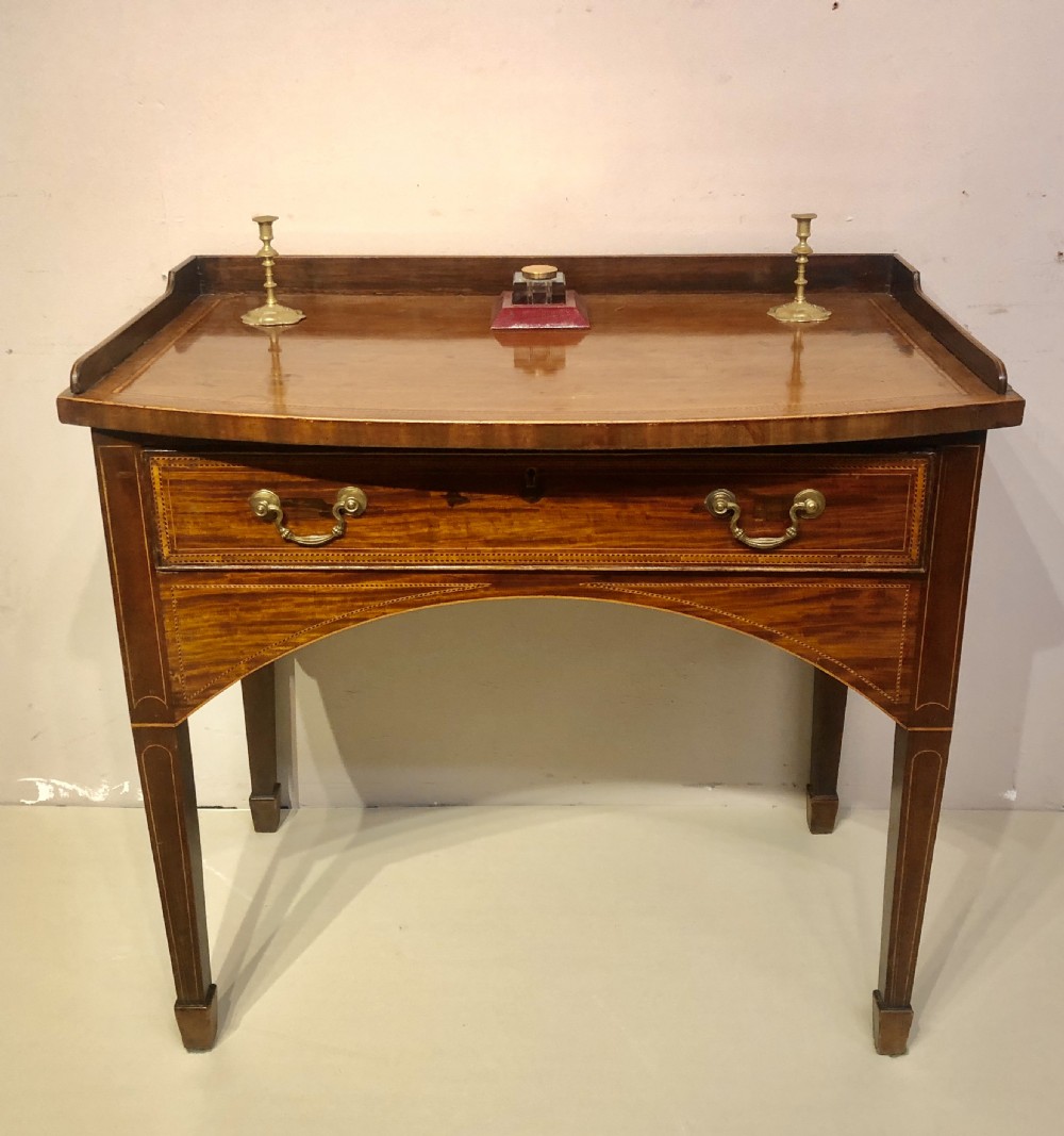 Antique mahogany bow fronted dressing/writing table.