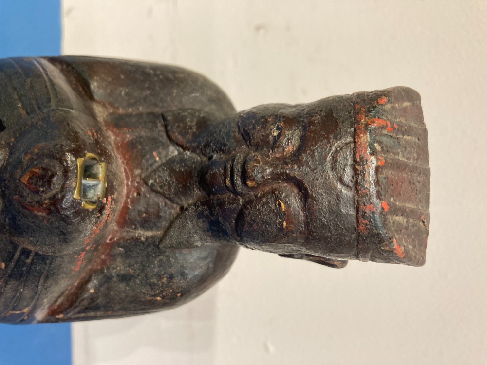 Carved wood painted figure of a deity. View II