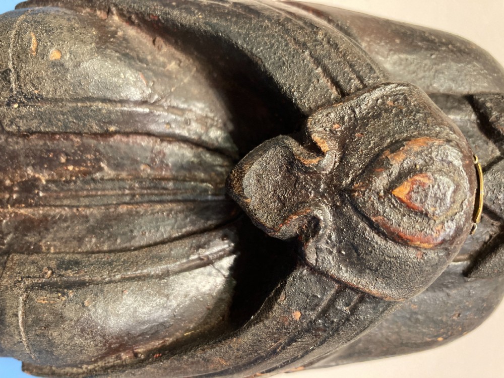 Carved wood painted figure of a deity. View III