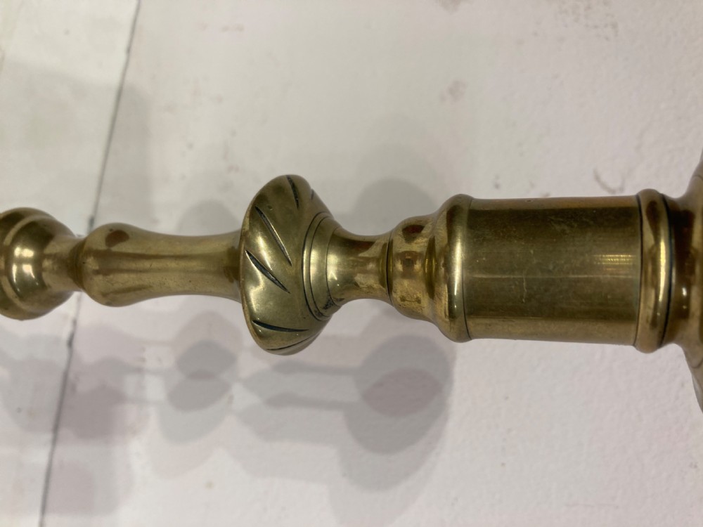 Pair of Georgian brass candlesticks. View III