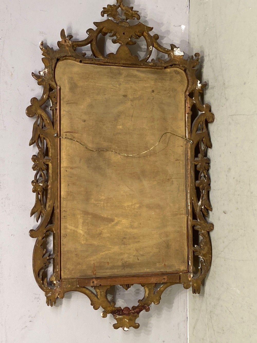 Chippendale style carved giltwood wall mirror. View VI