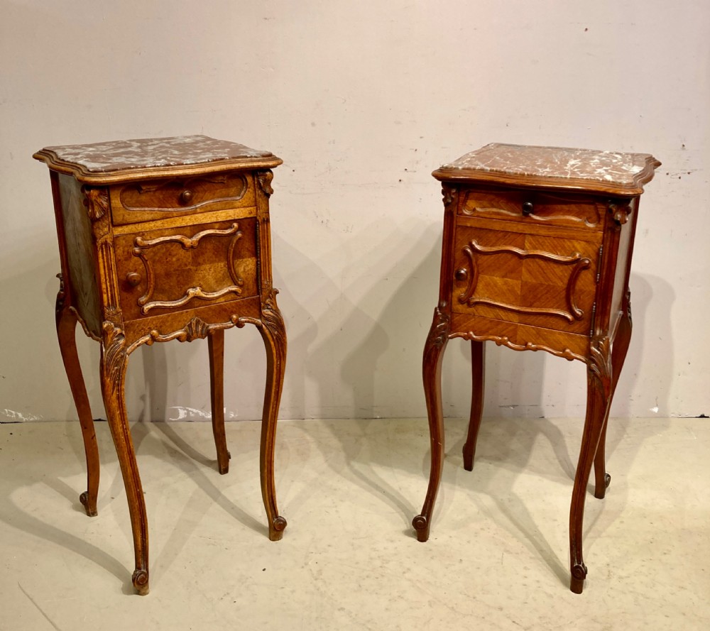Matched pair of 19th century French bedside tables.