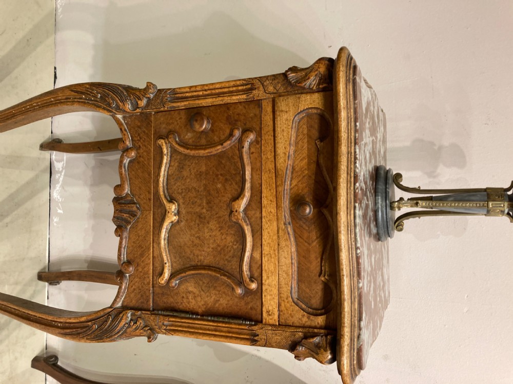 Matched pair of 19th century French bedside tables. View III