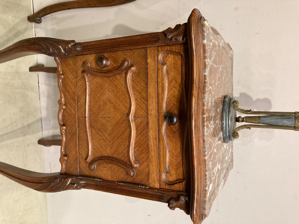 Matched pair of 19th century French bedside tables. View IV