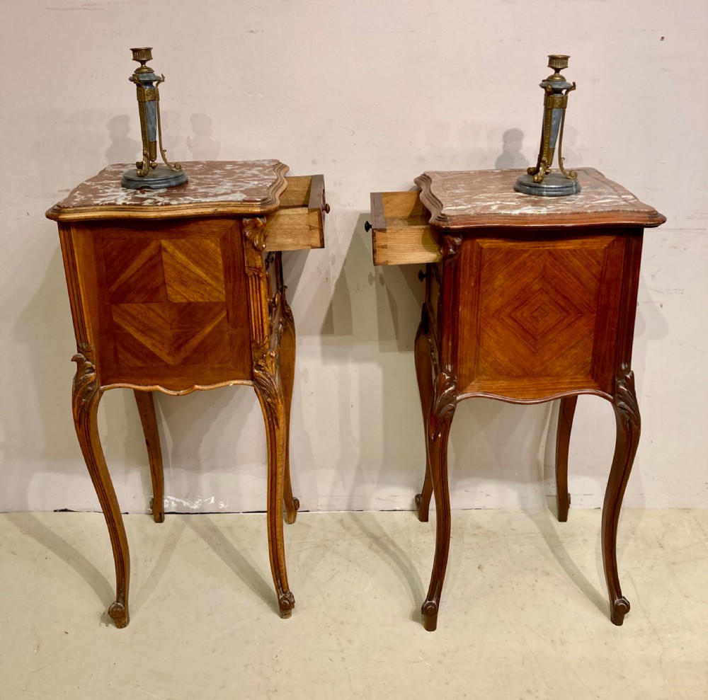 Matched pair of 19th century French bedside tables. View VI