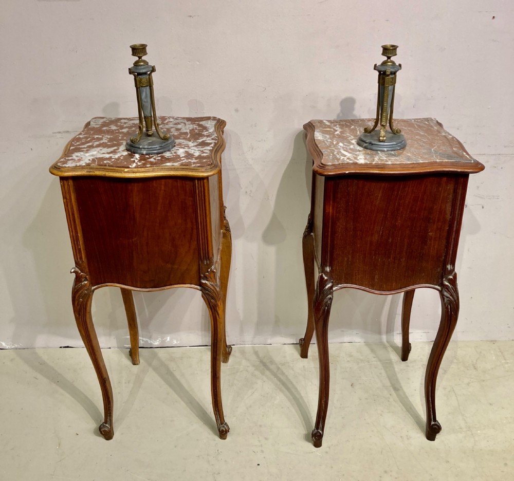 Matched pair of 19th century French bedside tables. View VII
