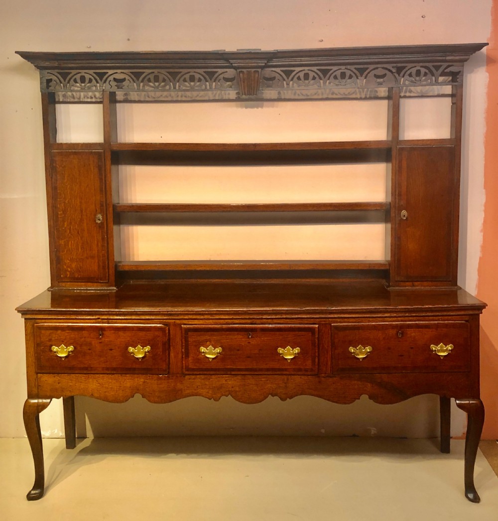 Georgian oak cabriole leg dresser and shelves.
