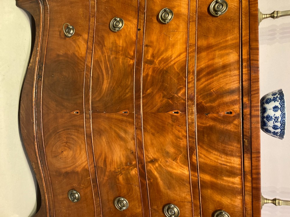 Antique serpentine  mahogany chest of drawers. View II